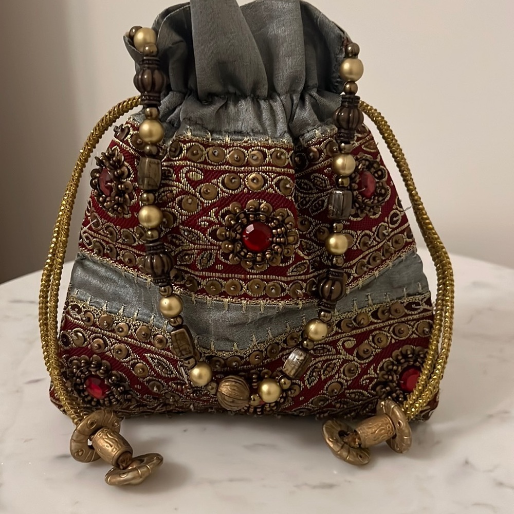 Pouch with drawstring and handle